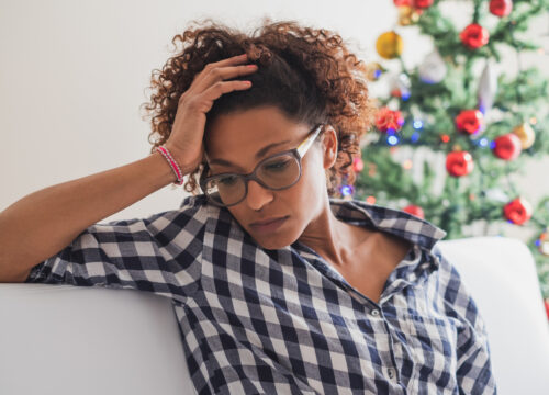 Stressed woman at home during Christmas