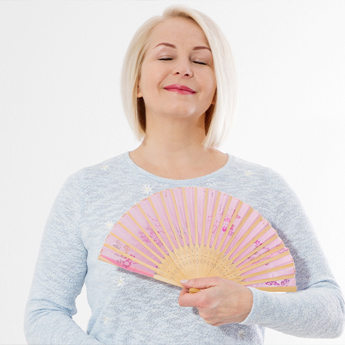 Woman with a folding hand fan